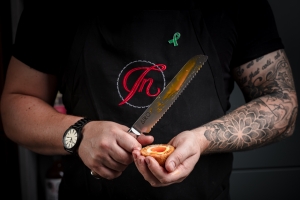 Dineindulge chef holding a scotch egg
